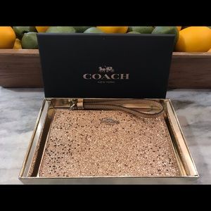 Coach- Star glitter wristlet
